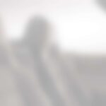 Blurred car interior with two passengers