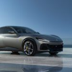 Sleek gray sports SUV on reflective surface