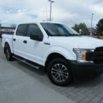 White crew cab truck front angle
