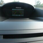 Upper dashboard display showing rear camera view
