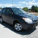 Front three-quarter view of dark SUV