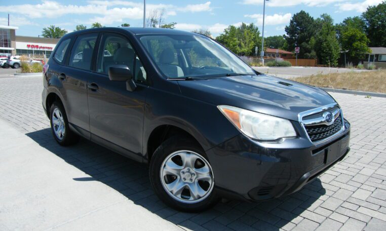 Front three-quarter view of dark SUV