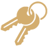 Two gold keys on black background